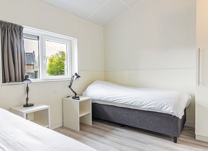 Cozy living room of Nesserduinen 42D, vacation home in Nes, Ameland with comfortable seating area.