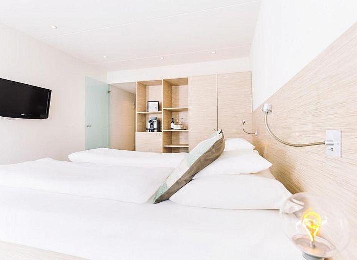 Gemuetliches Esszimmer im Logement Zee van Tijd, Nes, Ameland mit moderner Einrichtung.