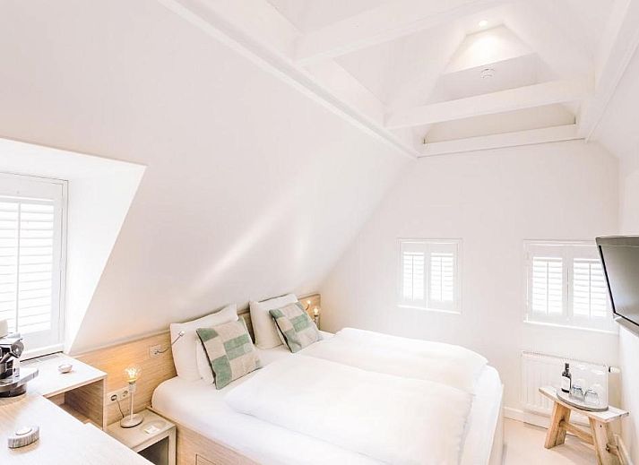 Gemuetliches Esszimmer im Logement Zee van Tijd, Nes, Ameland mit moderner Einrichtung.