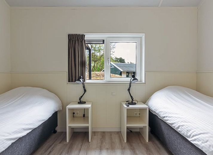 Geraeumige Terrasse im Ferienhaus in Nes, Ameland, ideal zum Entspannen in der Natur der Watteninseln.