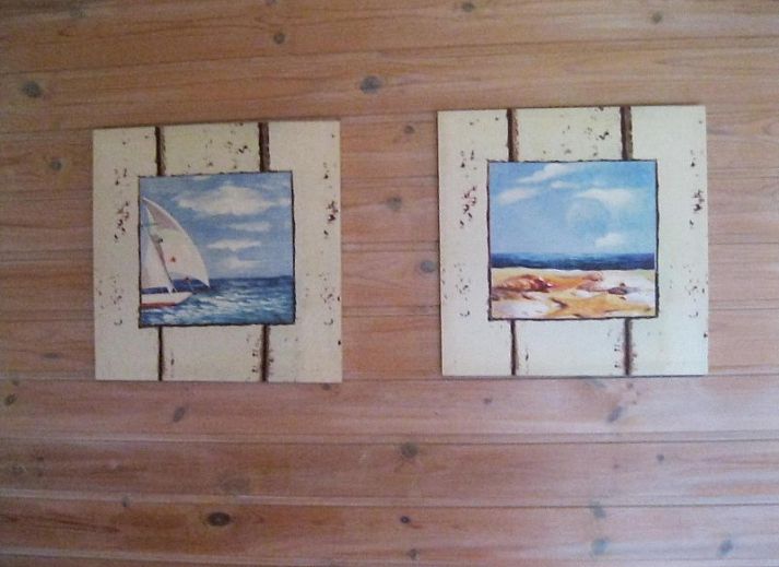 Cozy living room in Geertje-Aaltje vacation home, Nes, Ameland with comfortable seating area.