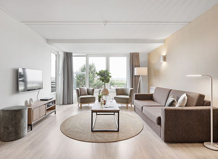 Stylish living room in Ameland State 2-bed apartment in Nes, Ameland with comfortable furniture and beautiful views.