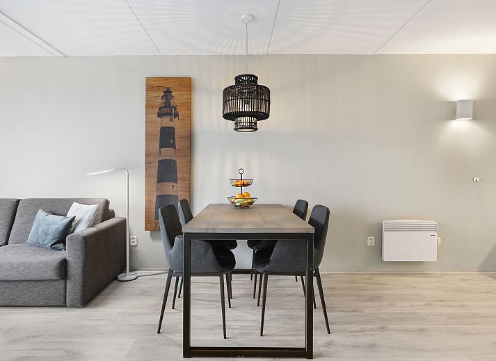 Stylish living room in Ameland State 2-bed apartment in Nes, Ameland with comfortable furniture and beautiful views.