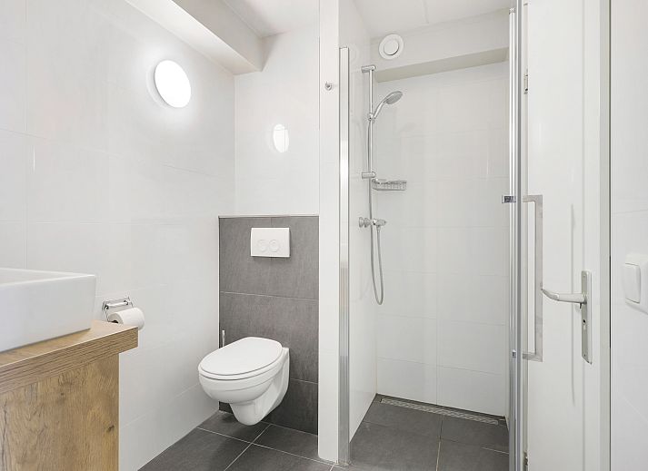 Exterior of Ameland State 2-bed apartment in Nes, Ameland with modern architecture and balcony.