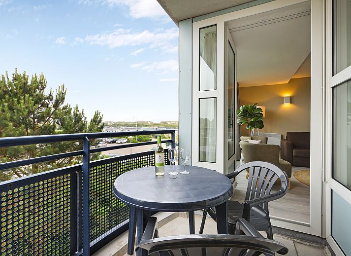 Open kitchen and living room in Ameland State 2-bed apartment in Nes, Ameland, ideal for cozy get-togethers.