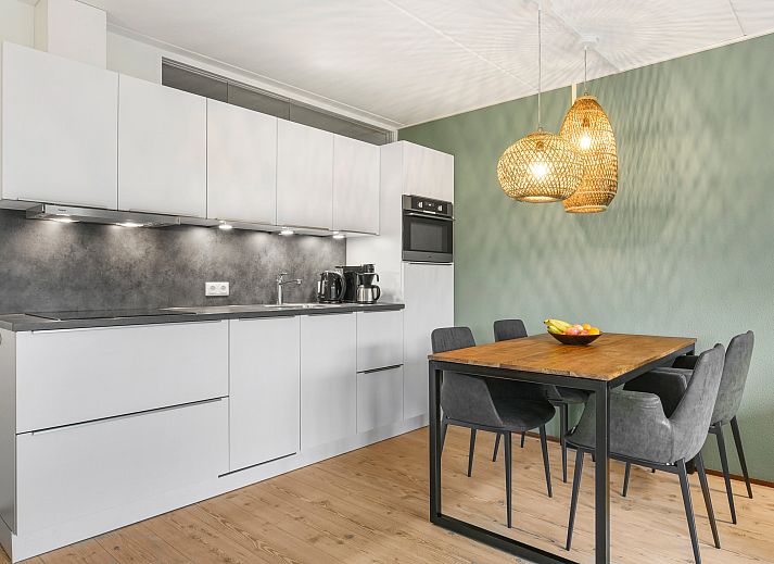 Exterior of Ameland State 4-person apartment in Nes, Ameland with balcony and terrace.