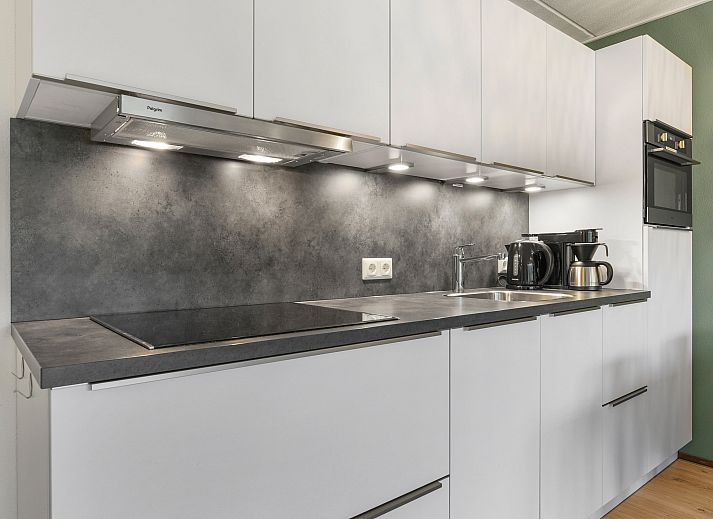 Exterior of Ameland State 4-person apartment in Nes, Ameland with balcony and terrace.