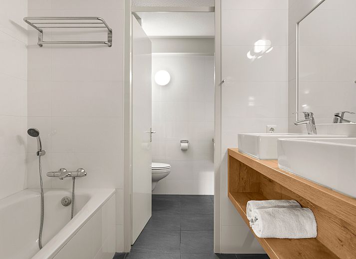 Modern kitchen and dining area in Ameland State 4-person apartment in Nes, Ameland.