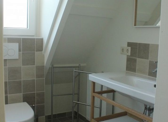 Charming vacation home Westhoek in Schiermonnikoog with cozy terrace in the Wadden Islands.