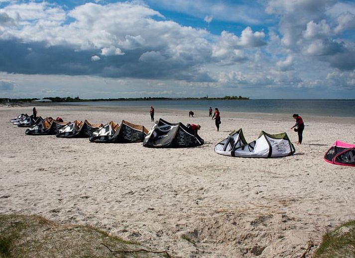 Cozy interior of Holiday Home in Workum with wooden interior, bunk bed and dining area, ideal for a stay at the IJsselmeer.