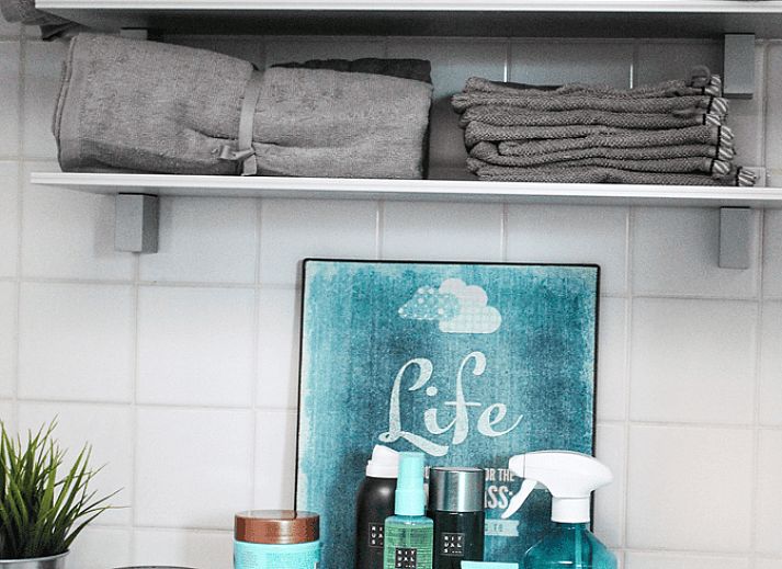 Spacious dining room in Holiday Home in Oudega, located on Lake Heeg in the Frisian Lakes, with a robust wooden table and modern furnishings.