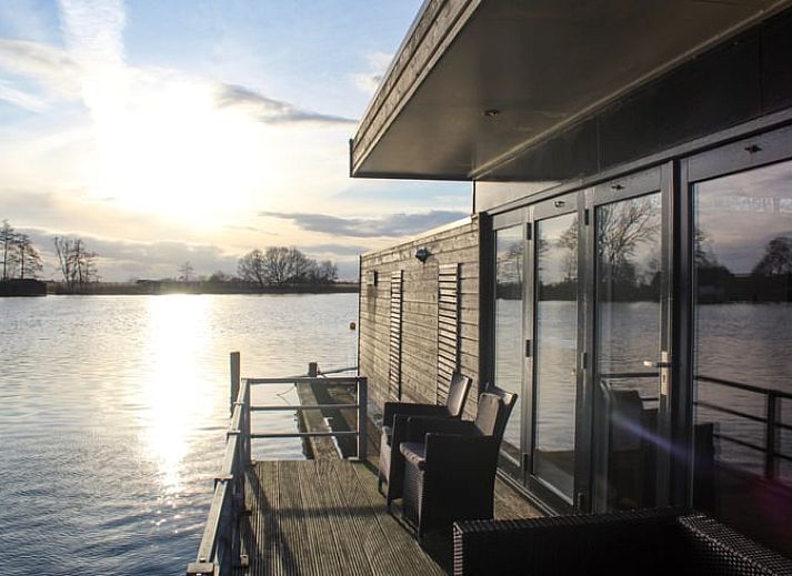 Stylish dining area in Holiday Home in Oudega, located on Lake Heeg in the Frisian Lakes, with modern decor and cozy atmosphere.