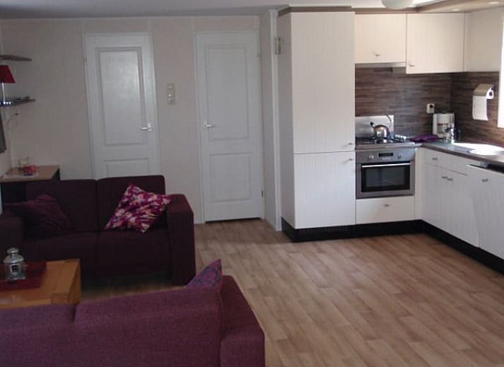 Veranda of Cottage in Terherne overlooking green fields, located in Sneekermeer, Frisian lakes.