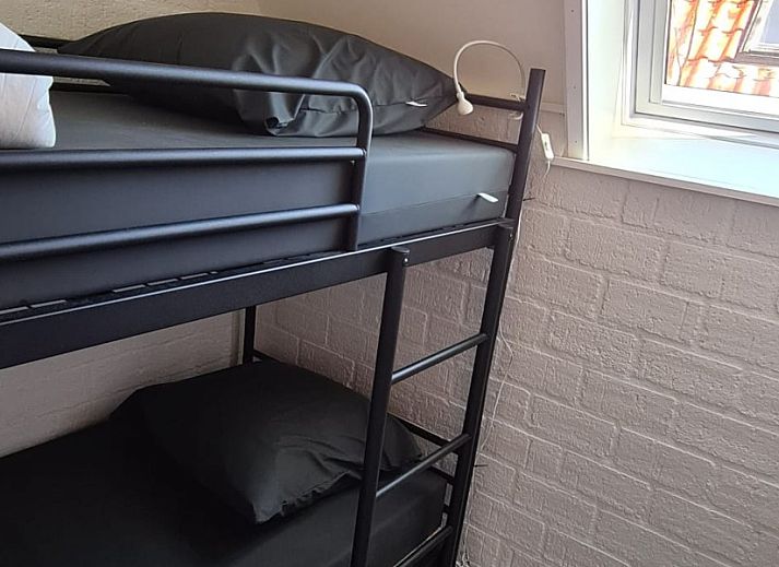 Aerial view of Bungalow Sneekermeer with sailboat in Goingarijp, located on the waters of the Frisian lakes for a relaxing vacation.