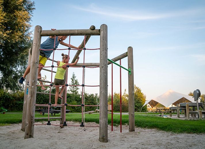 Esonstad Basis camping site C1 in Anjum, view over green fields and nearby Lauwersmeer.