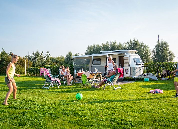 Esonstad Basis camping site C1 in Anjum, view over green fields and nearby Lauwersmeer.