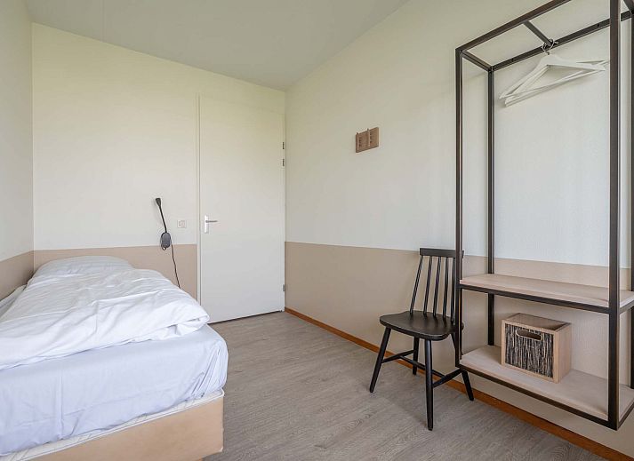 Bright living room of the Detached House in Anjum, located on the Lauwersmeer in the Frisian Lakes, with modern furnishings and views of the terrace.