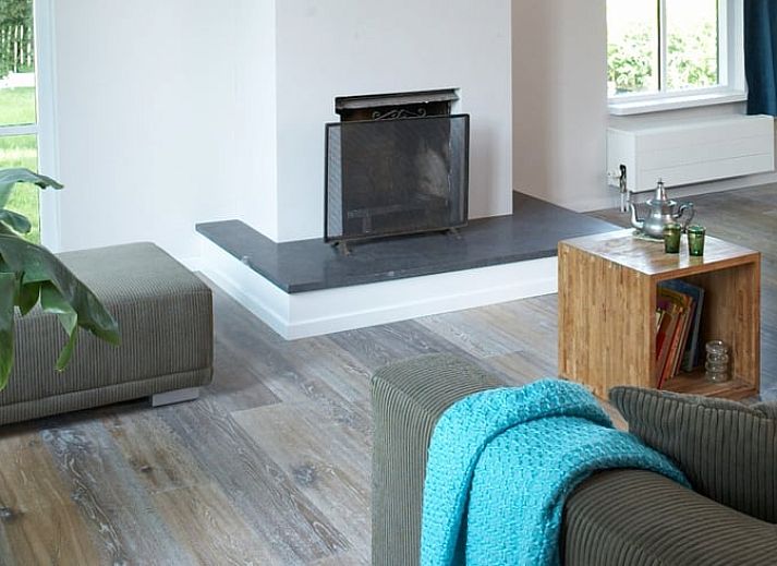 Vacation home in Kollumerpomp, located in the green nature of Lauwersmeer, offers a charming exterior with traditional Frisian architecture.