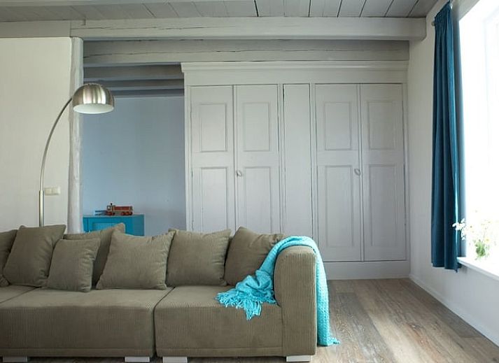 Vacation home in Kollumerpomp, located in the green nature of Lauwersmeer, offers a charming exterior with traditional Frisian architecture.