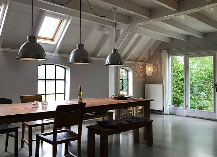 Vacation home in Kollumerpomp, located in the green nature of Lauwersmeer, offers a charming exterior with traditional Frisian architecture.