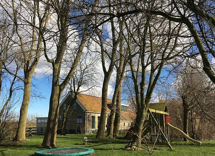 Stylish indoor space in Holiday Home in Kollumerpomp, Lauwersmeer, with comfortable sofa and cozy furnishings.