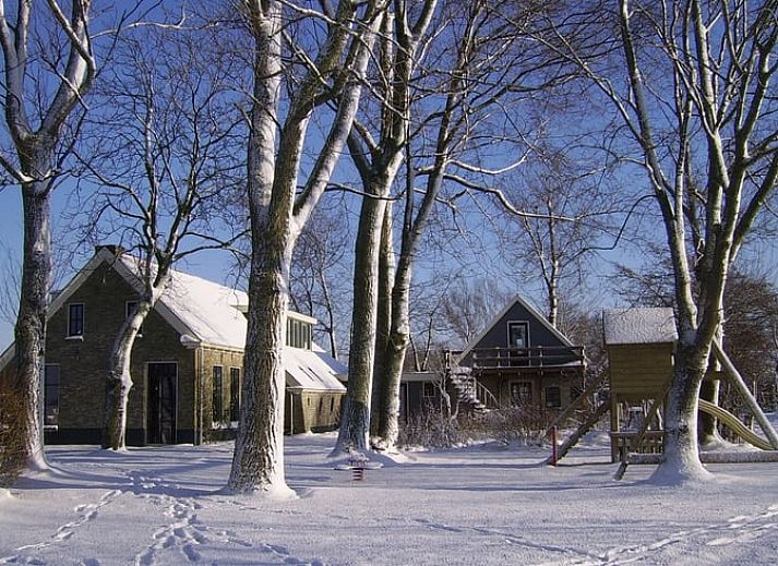 Stylish indoor space in Holiday Home in Kollumerpomp, Lauwersmeer, with comfortable sofa and cozy furnishings.