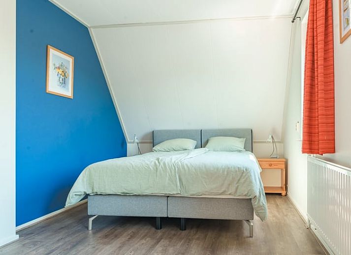 Gezellige tuin bij Vakantiehuis in Schoonloo, Midden Drenthe, met terras en groen.