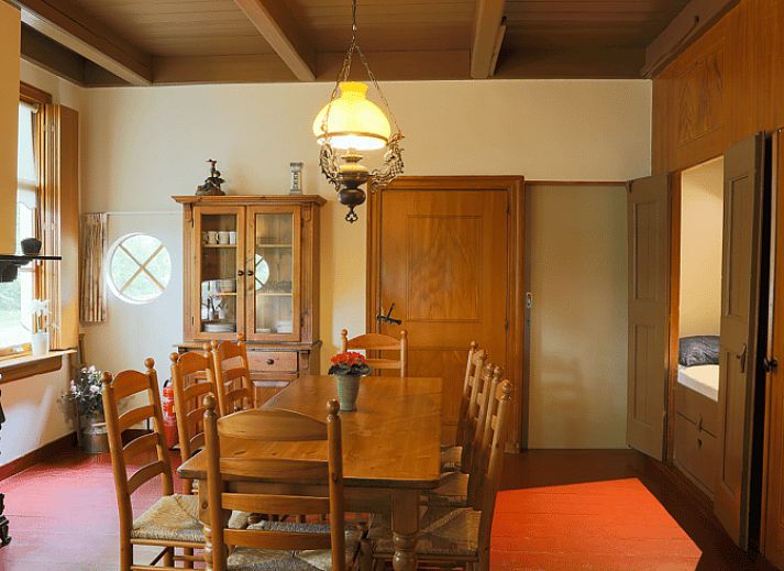 Spacious terrace at vacation home in Orvelte, Central Drenthe, ideal for outdoor meals.