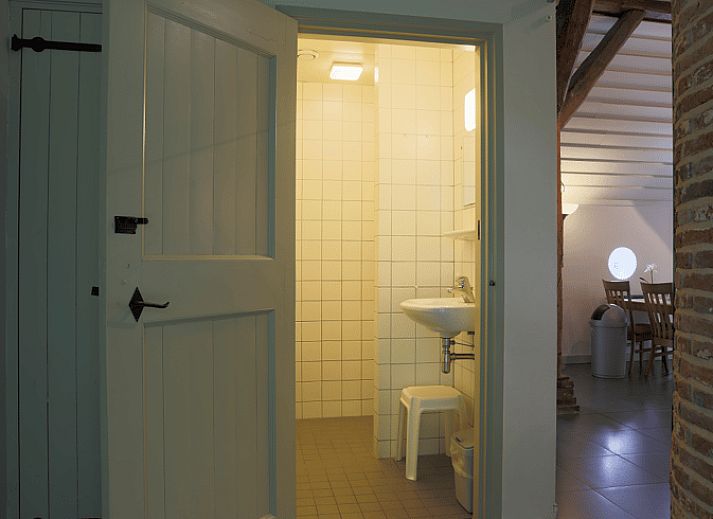 Spacious terrace at vacation home in Orvelte, Central Drenthe, ideal for outdoor meals.