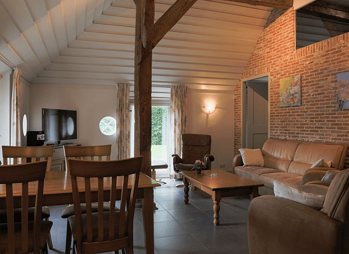 Spacious terrace at vacation home in Orvelte, Central Drenthe, ideal for outdoor meals.