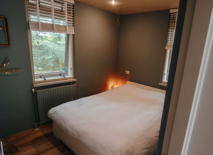 Gemuetliches Wohnzimmer in Cottage in Gasselte, Ferienhaus in Drenthe mit Blick auf den Wald.