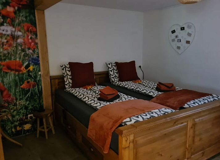 Snowy terrace of Holiday cottage in Gasselte, Drenthe, with serene winter nature and an inviting porch.