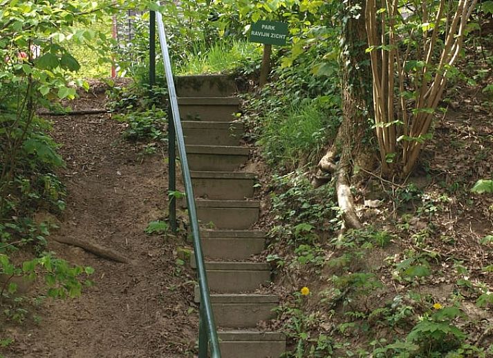 Evening in the garden of Holiday Home in Gasselte, Middle Drenthe, with cozy fire pit and comfortable seating.