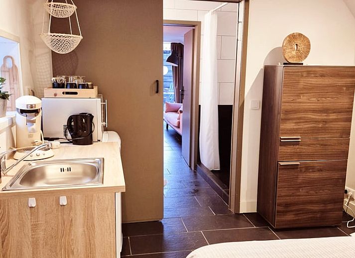 Bedroom in Holiday Home in Gasselte with beautiful nature theme on the wall.