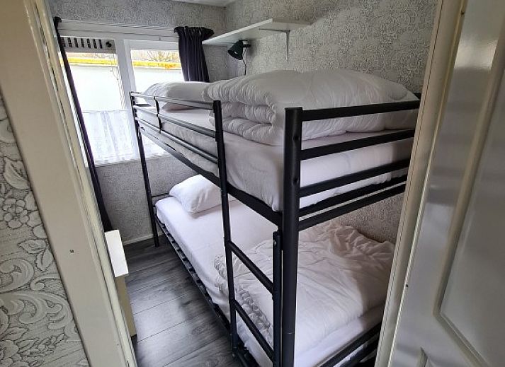 Cozy sitting area on the porch of Chalet Buitenlust in Midden Drenthe.