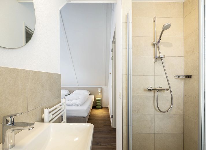 Bright living room in 8-person house 8C, Westerbork, with views of the surroundings.