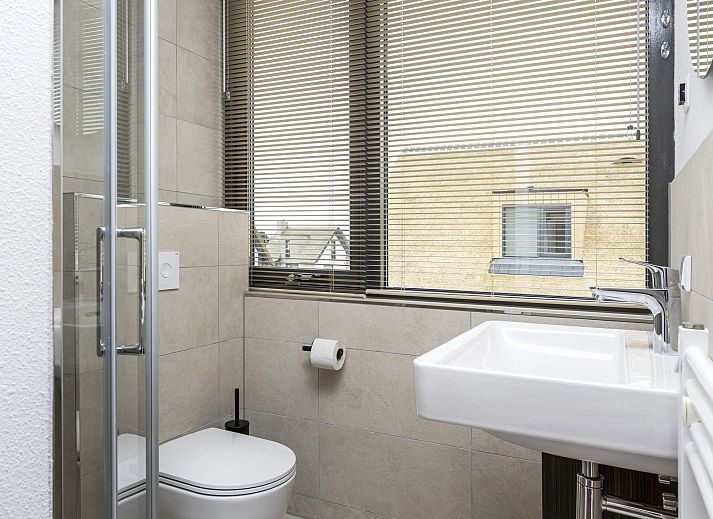 Bright living room in 8-person house 8C, Westerbork, with views of the surroundings.