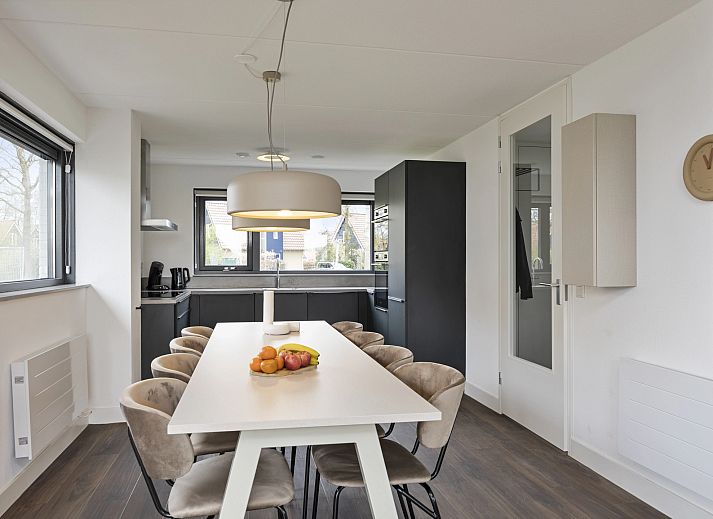 Bright living room in 8-person house 8C, Westerbork, with views of the surroundings.
