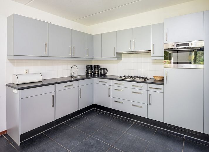 Zandduin Villa 12, a charming vacation home in Hooghalen, Central Drenthe, with a traditional brick facade and serene natural surroundings.