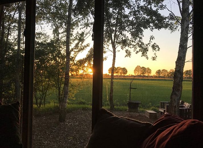 Cozy sitting area with wood stove in cottage in Mantinge, Central Drenthe.