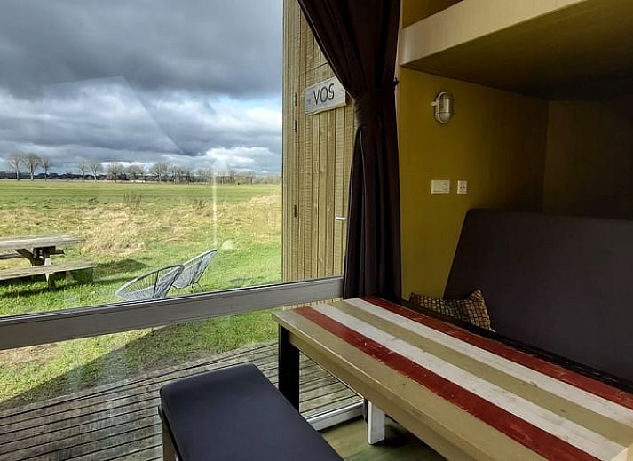 Enjoy nature around Cottage in Mantinge, vacation home in Central Drenthe, with wide views over green fields.
