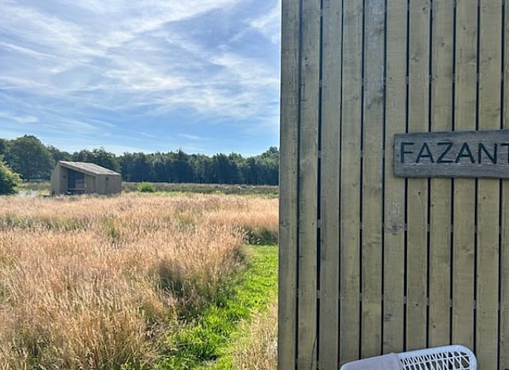 Cozy indoor area of Huisje in Mantinge, vacation home in Central Drenthe, with cozy sleeping quarters and lots of natural light.