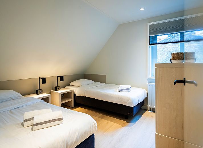 Stylish kitchen in Hof van Saksen 8-bed farmhouse 8L, Nooitgedacht, Drenthe, with modern appliances and wine.