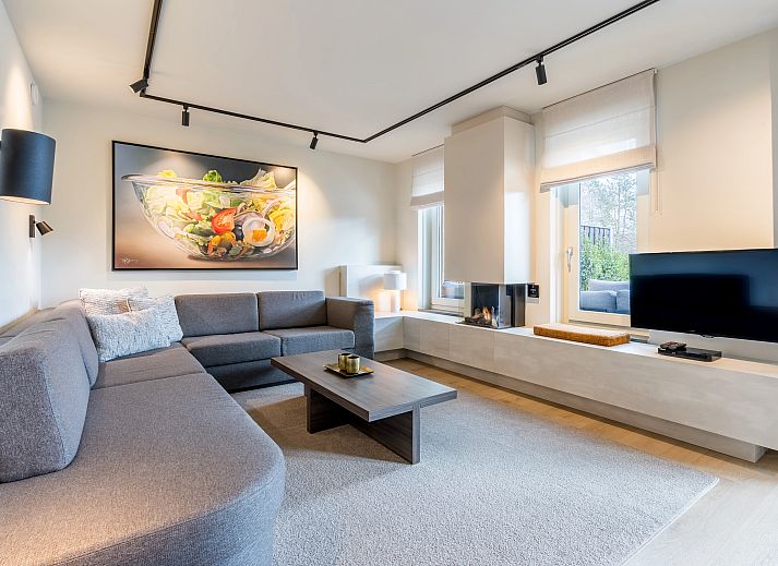 Spacious dining room in Hof van Saksen, 12-bed Luxury Culinary Farmhouse in Nooitgedacht, Drenthe with modern furnishings.