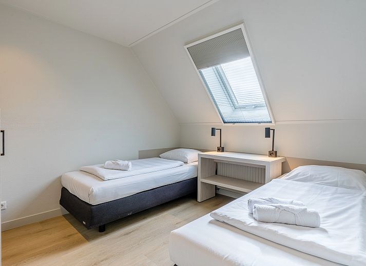 Cozy living room with modern decor in Hof van Saksen, 6-bed Wellness Waterfront farmhouse, Nooitgedacht, Drenthe.