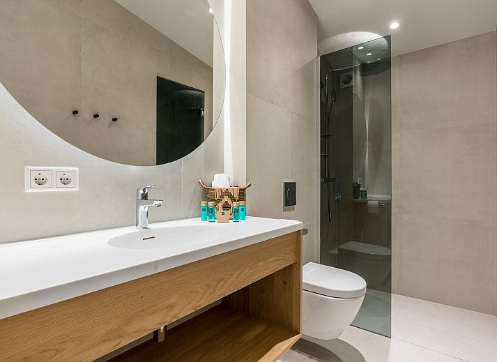 Modern kitchen with cooking island in Hof van Saksen, 6-bed Wellness Waterfront farmhouse, Nooitgedacht, Drenthe.