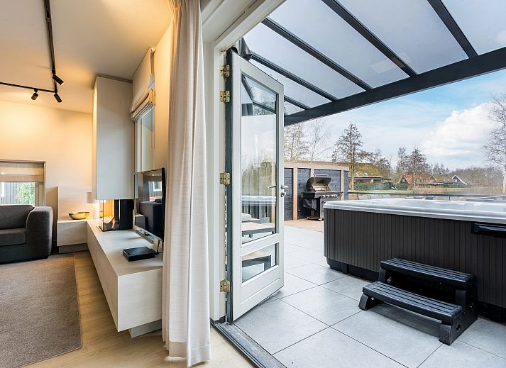 Modern kitchen with cooking island in Hof van Saksen, 6-bed Wellness Waterfront farmhouse, Nooitgedacht, Drenthe.