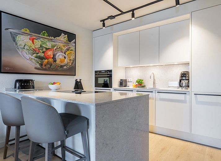 Stylish kitchen overlooking the terrace in Hof van Saksen, 6-bed Wellness Waterfront farmhouse, Nooitgedacht, Drenthe.