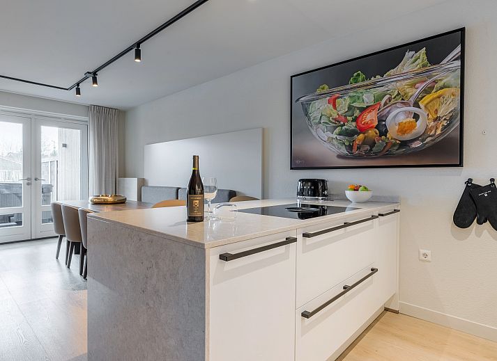 Stylish kitchen overlooking the terrace in Hof van Saksen, 6-bed Wellness Waterfront farmhouse, Nooitgedacht, Drenthe.