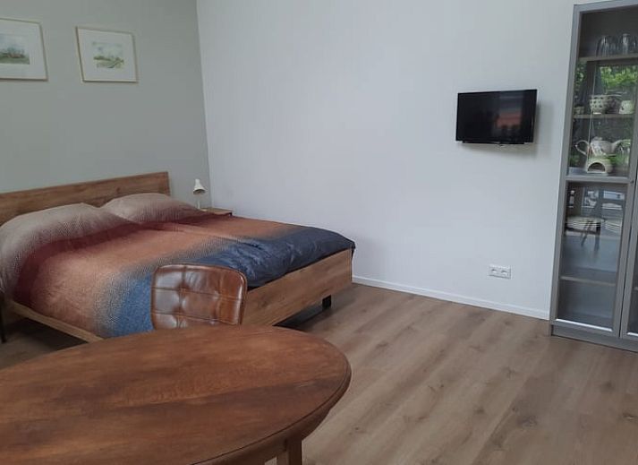 Cozy dining area in Holiday Home in Smilde, Central Drenthe overlooking terrace.